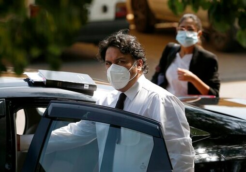 Faisal Siddiqi, center, a lawyer for the family of Daniel Pearl, an American Wall Street Journal reporter who was kidnapped and killed in Pakistan, arrives at the Supreme Court for an appeal hearing in the Pearl case, in Islamabad, Pakistan, Tuesday, Sept. 15, 2020. The much-awaited court hearing against the acquittal of a British Pakistani man and three others in the 2002 kidnapping and killing of Pearl, was delayed for a week on Tuesday when judges could not take up the case due to the absence of a prosecutor whose mother died recently, a defense lawyer said. (AP Photo/Anjum Naveed)