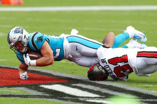 Carolina Panthers running back Christian McCaffrey (22) gets taken down by Tampa Bay Buccaneers safety Antoine Winfield Jr. (31) during the first half of an NFL football game Sunday, Sept. 20, 2020, in Tampa, Fla. (AP Photo/Mark LoMoglio)