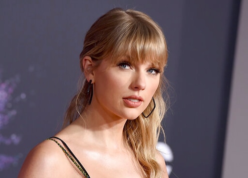 FILE - This Nov. 24, 2019 file photo shows Taylor Swift at the American Music Awards in Los Angeles. A Texas man is sentenced to 30 months in prison after pleading guilty to stalking and sending threatening letters about Swift. A federal judge in Nashville, Tennessee handed down the sentence Wednesday to Eric Swarbrick, who sent over 40 letters and emails to Swift's former record label in 2018, asking the CEO to introduce him to Swift. Over time the letters became more violent and threatening. (Photo by Jordan Strauss/Invision/AP, File) FILE - This Nov. 24, 2019 file photo shows Taylor Swift at the American Music Awards in Los Angeles. A Texas man is sentenced to 30 months in prison after pleading guilty to stalking and sending threatening letters about Swift. A federal judge in Nashville, Tennessee handed down the sentence Wednesday to Eric Swarbrick, who sent over 40 letters and emails to Swift's former record label in 2018, asking the CEO to introduce him to Swift. Over time the letters became more violent and threatening. (Photo by Jordan Strauss/Invision/AP, File)