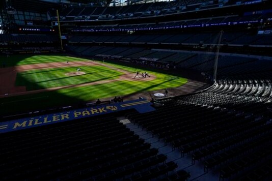 The seats at Miller Park are empty during the ninth inning of a baseball game between the Milwaukee Brewers and the Pittsburgh Pirates Sunday, Aug. 30, 2020, in Milwaukee. (AP Photo/Morry Gash)