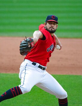 Cleveland Indians relief pitcher Brad Hand delivers to Pittsburgh Pirates' Josh Bell during the ninth inning of a baseball game in Cleveland, Sunday, Sept. 27, 2020. Hand induced Bell into a fly out to end the game. The Indians won 8-6. (AP Photo/Phil Long)