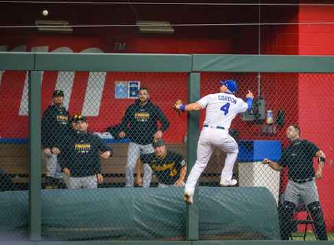 Kansas City Royals left fielder Alex Gordon (4) cannot reach a home run off the bat of Pittsburgh Pirates' Josh Bell during the second inning of a baseball game in Kansas City, Mo., Saturday, Sept. 12, 2020. (AP Photo/Reed Hoffmann) Kansas City Royals left fielder Alex Gordon (4) cannot reach a home run off the bat of Pittsburgh Pirates' Josh Bell during the second inning of a baseball game in Kansas City, Mo., Saturday, Sept. 12, 2020. (AP Photo/Reed Hoffmann)