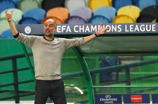 Manchester City's head coach Pep Guardiola reacts during the Champions League quarterfinal soccer match between Lyon and Manchester City at the Jose Alvalade stadium in Lisbon, Portugal, Saturday, Aug. 15, 2020. (Miguel A. Lopes/Pool via AP)