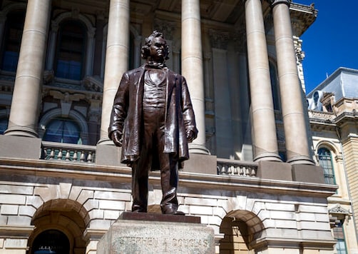 FILE - In this Aug. 19, 2020 file photo, a statue of Stephen Douglas stands in front of the east entrance to the Illinois State Capitol, in Springfield, Ill. Illinois officials approved the removal of the statue of the 19th century senator from Illinois who owned slaves and espoused the notion that each territory should decide whether slavery would be allowed. (Justin L. Fowler/The State Journal-Register via AP File)/The State Journal-Register via AP)