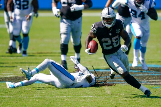 Las Vegas Raiders running back Josh Jacobs runs against the Carolina Panthers during the second half of an NFL football game Sunday, Sept. 13, 2020, in Charlotte, N.C. (AP Photo/Brian Blanco)