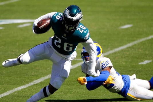 Philadelphia Eagles' Miles Sanders (26) runs past Los Angeles Rams' Troy Hill (22) during the first half of an NFL football game, Sunday, Sept. 20, 2020, in Philadelphia. (AP Photo/Laurence Kesterson) Philadelphia Eagles' Miles Sanders (26) runs past Los Angeles Rams' Troy Hill (22) during the first half of an NFL football game, Sunday, Sept. 20, 2020, in Philadelphia. (AP Photo/Laurence Kesterson)