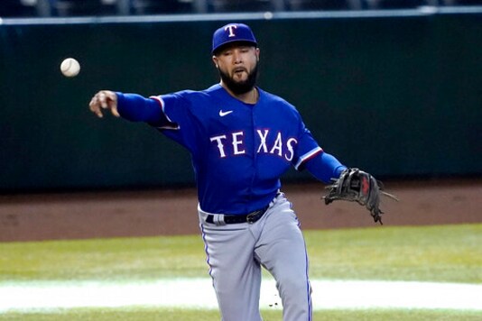 Texas Rangers' Isiah Kiner-Falefa fields a ground ball hit by Arizona Diamondbacks' Ketel Mate during the first inning of a baseball game, Wednesday, Sept. 23, 2020, in Phoenix. Marte was safe on a throwing error by Kiner-Falefa. (AP Photo/Matt York)