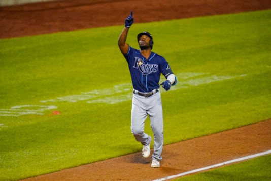 Tampa Bay Rays' Randy Arozarena gestures as he runs toward home plate after hitting a two-run home run during the sixth inning of a baseball game against the New York Mets Wednesday, Sept. 23, 2020, in New York. (AP Photo/Frank Franklin II) Tampa Bay Rays' Randy Arozarena gestures as he runs toward home plate after hitting a two-run home run during the sixth inning of a baseball game against the New York Mets Wednesday, Sept. 23, 2020, in New York. (AP Photo/Frank Franklin II)