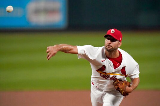 St. Louis Cardinals starting pitcher Adam Wainwright throws during the first inning of a baseball game against the Cincinnati Reds Friday, Sept. 11, 2020, in St. Louis. (AP Photo/Jeff Roberson)