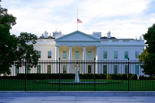 An American flag flies at half-staff over the White House in Washington, Saturday, Sept. 19, 2020.  Federal officials have intercepted an envelope addressed to the White House that contained the poison ricin. That's according to a law enforcement official who spoke to The Associated Press on Saturday.   (AP Photo/Patrick Semansky)