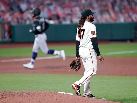 San Francisco Giants starting pitcher Johnny Cueto (47) stands on the mound as Colorado Rockies' Kevin Pillar, left, rounds the bases after hitting a solo home run during the third inning of a baseball game on Monday, Sept. 21, 2020, in San Francisco. (AP Photo/Tony Avelar) San Francisco Giants starting pitcher Johnny Cueto (47) stands on the mound as Colorado Rockies' Kevin Pillar, left, rounds the bases after hitting a solo home run during the third inning of a baseball game on Monday, Sept. 21, 2020, in San Francisco. (AP Photo/Tony Avelar)
