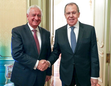 In this photo released by the Russian Foreign Ministry Press Service, Russian Foreign Minister Sergey Lavrov, right, and Chairman of the Board of the Eurasian Economic Commission Mikhail Myasnikovich pose for a photo prior to the talks in Moscow, Russia, Tuesday, Sept. 22, 2020. (Russian Foreign Ministry Press Service via AP)