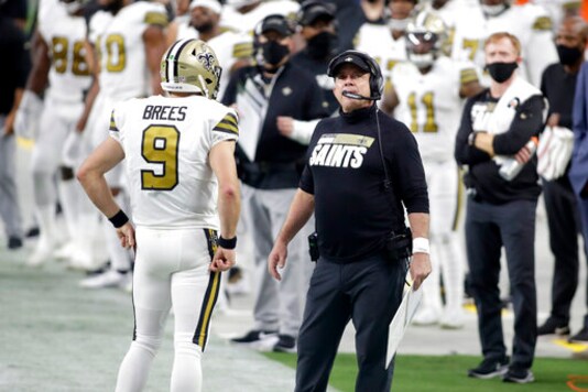 New Orleans Saints head coach Sean Payton, right, speak with quarterback Drew Brees (9) during the first half of an NFL football game, Monday, Sept. 21, 2020, in Las Vegas. (AP Photo/Isaac Brekken)