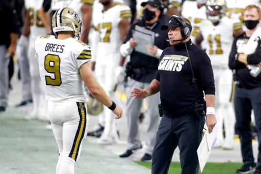 New Orleans Saints head coach Sean Payton speaks with quarterback Drew Brees (9) during the first half of an NFL football game against the Las Vegas Raiders, Monday, Sept. 21, 2020, in Las Vegas. (AP Photo/Isaac Brekken) New Orleans Saints head coach Sean Payton speaks with quarterback Drew Brees (9) during the first half of an NFL football game against the Las Vegas Raiders, Monday, Sept. 21, 2020, in Las Vegas. (AP Photo/Isaac Brekken)