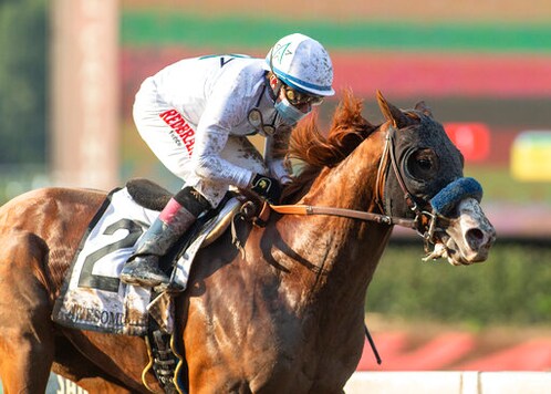 In a photo provided by Benoit Photo, Improbable and jockey Drayden Van Dyke win the Grade I, $300,000 Awesome Again Stakes horse race Saturday, Sept. 26, 2020, at Santa Anita in Arcadia, Calif. (Benoit Photo via AP)