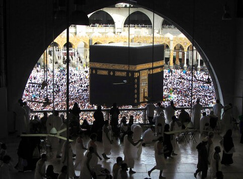 FILE - In this May 25, 2019 file photo, Muslim worshippers circumambulate the Kaaba, the cubic building at the Grand Mosque, during the minor pilgrimage, known as Umrah in the Muslim holy city of Mecca, Saudi Arabia. Authorities on Monday, Sept. 21, 2020, released new details on how it plans to gradually allow Muslims back to Islam's holiest site in Mecca to perform the smaller-year-round pilgrimage, which has been suspended for the past seven months due to the coronavirus (AP Photo/Amr Nabil, File)