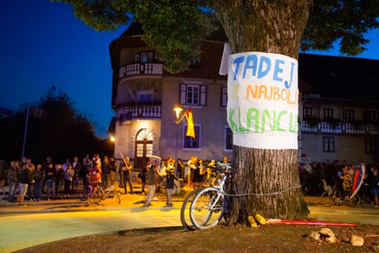 Supporters of Slovene cyclist Tadej Pogacar celebrate his victory at the Tour De France in his hometown of Komenda, central Slovenia, Saturday, Sept. 19, 2020. In an incredible climax to the Tour de France, Tadej Pogacar crushed his fellow Slovenian, Primoz Roglic, in the last stage before the finish in Paris. The banner in Slovenien reads: 