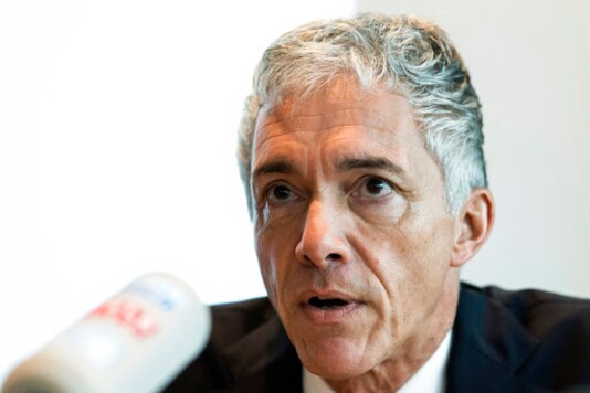 FILE - In this Wednesday, Nov. 21, 2018 file photo, Switzerland's attorney general Michael Lauber briefs the media at a news conference in Bern, Switzerland. Lauber has offered to resign in the latest fallout from meetings he had with FIFA president Gianni Infantino during a sprawling investigation into soccer corruption. Lauber offered his resignation to the parliamentary judicial commission ahead of the publication of a federal court ruling in his appeal against being disciplined in March for misconduct. (Peter Schneider/Keystone via AP, file)