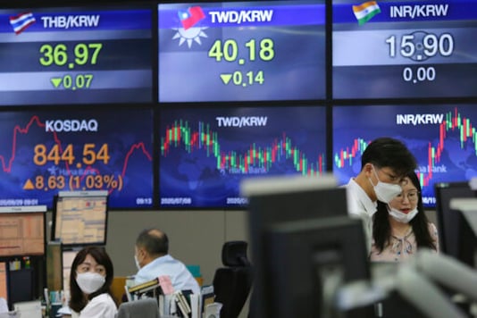 Currency traders watch monitors at the foreign exchange dealing room of the KEB Hana Bank headquarters in Seoul, South Korea, Tuesday, Sept. 29, 2020. Asian stocks were mixed Tuesday after Wall Street recovered some of this month's losses as investors looked ahead to a debate between President Donald Trump and his challenger in the November election, former Vice President Joe Biden. (AP Photo/Ahn Young-joon) Currency traders watch monitors at the foreign exchange dealing room of the KEB Hana Bank headquarters in Seoul, South Korea, Tuesday, Sept. 29, 2020. Asian stocks were mixed Tuesday after Wall Street recovered some of this month's losses as investors looked ahead to a debate between President Donald Trump and his challenger in the November election, former Vice President Joe Biden. (AP Photo/Ahn Young-joon)