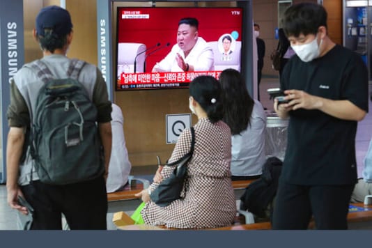 People watch a screen showing a file image of North Korean leader Kim Jong Un during a news program at the Seoul Railway Station in Seoul, South Korea, Friday, Sept. 25, 2020. Kim apologized Friday over the killing of a South Korea official near the rivals' disputed sea boundary, saying he's 