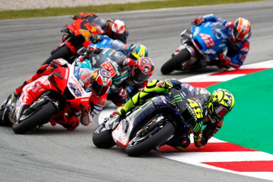 MotoGP rider Valentino Rossi of Italy takes a curve followed by Jack Miller of Australia, left, during the Catalunya Motorcycle Grand Prix at the Barcelona Catalunya racetrack in Montmelo, near Barcelona, Spain, Sunday, Sept. 27, 2020. (AP Photo/Joan Monfort) MotoGP rider Valentino Rossi of Italy takes a curve followed by Jack Miller of Australia, left, during the Catalunya Motorcycle Grand Prix at the Barcelona Catalunya racetrack in Montmelo, near Barcelona, Spain, Sunday, Sept. 27, 2020. (AP Photo/Joan Monfort)