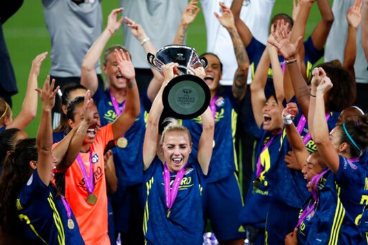Lyon's Alex Greenwood celebrates with the trophy after winning the Women's Champions League final soccer match between Wolfsburg and Lyon at the Anoeta stadium in San Sebastian, Spain, Sunday, Aug. 30, 2020. Lyon won 3-1. (Clive Brunskill/Pool via AP) Lyon's Alex Greenwood celebrates with the trophy after winning the Women's Champions League final soccer match between Wolfsburg and Lyon at the Anoeta stadium in San Sebastian, Spain, Sunday, Aug. 30, 2020. Lyon won 3-1. (Clive Brunskill/Pool via AP)