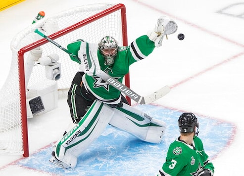 Dallas Stars goaltender Anton Khudobin (35) makes a save against the Tampa Bay Lightning during the third period of Game 4 of the NHL hockey Stanley Cup Final, Friday, Sept. 25, 2020, in Edmonton, Alberta. (Jason Franson/The Canadian Press via AP) Dallas Stars goaltender Anton Khudobin (35) makes a save against the Tampa Bay Lightning during the third period of Game 4 of the NHL hockey Stanley Cup Final, Friday, Sept. 25, 2020, in Edmonton, Alberta. (Jason Franson/The Canadian Press via AP)
