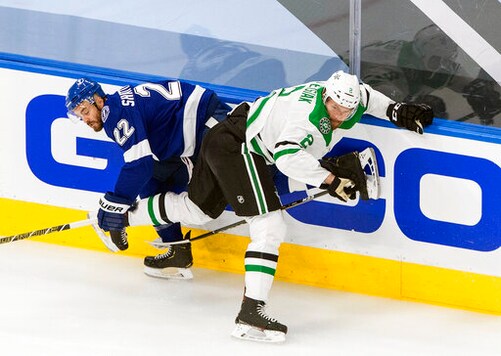 Dallas Stars' Jamie Oleksiak (2) checks Tampa Bay Lightning's Kevin Shattenkirk (22) during first-period NHL Stanley Cup finals hockey action in Edmonton, Alberta, Monday, Sept. 21, 2020. (Jason Franson/The Canadian Press via AP)