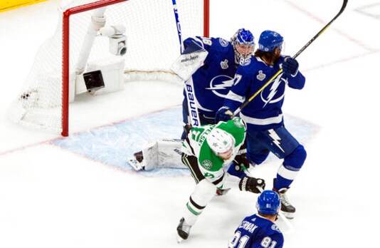 Dallas Stars' Joe Pavelski (16) scores against Tampa Bay Lightning goalie Andrei Vasilevskiy (88) as Lightning defenseman Ryan McDonagh (27) defends during second-period NHL Stanley Cup finals hockey action in Edmonton, Alberta, Monday, Sept. 21, 2020. (Jason Franson/The Canadian Press via AP)