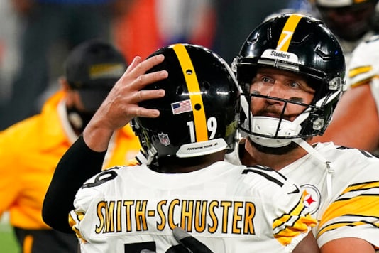FILE - Pittsburgh Steelers wide receiver JuJu Smith-Schuster (19) celebrates with Pittsburgh Steelers quarterback Ben Roethlisberger (7) after scoring a touchdown against the New York Giants during the fourth quarter of an NFL football game Monday, Sept. 14, 2020, in East Rutherford, N.J. The name Antwon Rose Jr., a Black Pittsburgh teenager shot in the back and killed by a white police officer in 2018, has his name on a white strip on the back of most Steelers helmets, (AP Photo/Seth Wenig, File) FILE - Pittsburgh Steelers wide receiver JuJu Smith-Schuster (19) celebrates with Pittsburgh Steelers quarterback Ben Roethlisberger (7) after scoring a touchdown against the New York Giants during the fourth quarter of an NFL football game Monday, Sept. 14, 2020, in East Rutherford, N.J. The name Antwon Rose Jr., a Black Pittsburgh teenager shot in the back and killed by a white police officer in 2018, has his name on a white strip on the back of most Steelers helmets, (AP Photo/Seth Wenig, File)