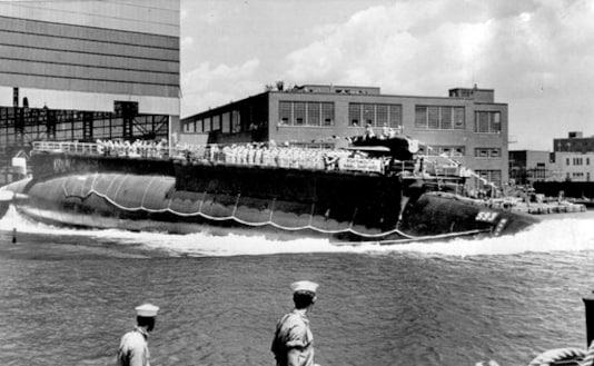 FILE - In this July 9, 1960, file photo, the U.S. Navy nuclear powered attack submarine USS Thresher is launched bow-first at the Portsmouth Navy Yard in Kittery, Maine. The Navy is releasing documents from the investigation into the deadliest submarine disaster in U.S. history. A judge ordered the release of the documents that pertain to the sinking of the USS Thresher 57 years ago, and the first batch was made public on Wednesday, Sept. 23, 2020. (AP Photo, File)