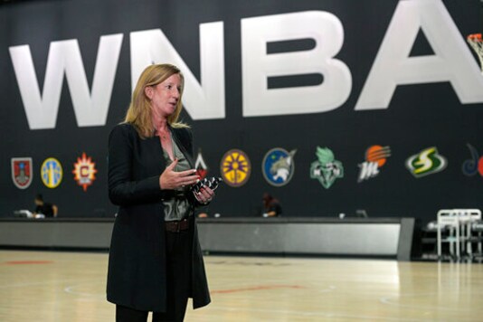 WNBA Commissioner Cathy Engelbert answers questions about a postponed game between the Seattle Storm and the Minnesota Lynx after Game 1 of a WNBA basketball semifinal round playoff game between the Connecticut Sun and the Las Vegas Aces, Sunday, Sept. 20, 2020, in Bradenton, Fla. (AP Photo/Phelan M. Ebenhack)
