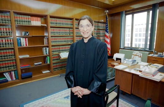 FILE- In this Aug. 3, 1993, file photo, then-Judge Ruth Bader Ginsburg poses in her robe in her office at U.S. District Court in Washington. Earlier, the Senate voted 96-3 to confirm Bader as the 107th justice and the second woman to serve on the Supreme Court. Ruth Bader Ginsburg died at her home in Washington, on Sept. 18, 2020, the Supreme Court announced. (AP Photo/Doug Mills, File)