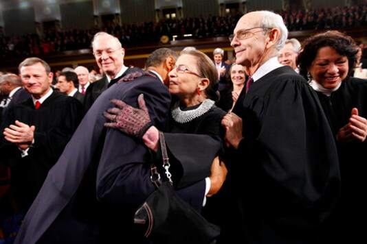 FILE - In this Jan. 25, 2011, file photo, President Barack Obama embraces Supreme Court Justice Ruth Bader Ginsburg on Capitol Hill in Washington before delivering his State of the Union address.  From left to right, Chief Justice John Roberts, Justice Anthony Kennedy, Obama, Justice Ginsburg, and Justice Stephen Breyer.  Ruth Bader Ginsburg died at her home in Washington on September 18, 2020, the Supreme Court announced.  (AP Photo / Pablo Martinez Monsiváis, Pool, File)