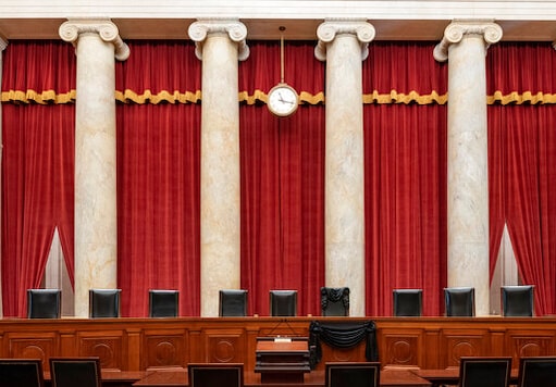 This Sept. 19, 2020, photo provided by the Supreme Court, shows the Bench draped for the death of Supreme Court Associate Justice Ruth Bader Ginsburg at the Supreme Court in Washington. (Fred Schilling/Collection of the Supreme Court of the United States via AP)