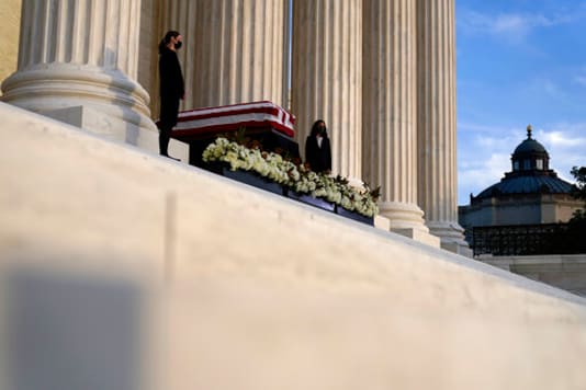 The flag-draped casket of Justice Ruth Bader Ginsburg lies in repose under the Portico at the top of the front steps of the U.S. Supreme Court building on Wednesday, Sept. 23, 2020, in Washington. Ginsburg, 87, died of cancer on Sept. 18. (AP Photo/Andrew Harnik, Pool)