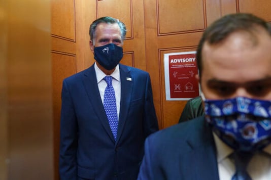 Sen. Mitt Romney, R-Utah, leaves the Senate Chamber after a procedural vote, at the Capitol in Washington, Monday, Sept. 21, 2020. Romney is one of four Republicans who could oppose a vote on a replacement for the late Justice Ruth Bader Ginsburg prior to Election Day. (AP Photo/J. Scott Applewhite)