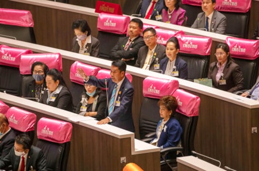 Parliament member from the Pheu Thai Party Sutin Klangsang speaks during a  Parliament session in Bangkok, Thailand, Thursday, Sept. 24, 2020. Lawmakers in Thailand are expected to vote Thursday on six proposed amendments to the constitution, as protesters supporting pro-democratic charter reforms gathered outside the parliament building. (AP Photo/Sakchai Lalit)