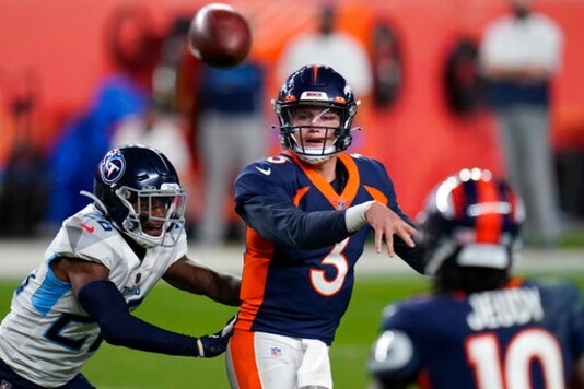 Denver Broncos quarterback Drew Lock (3) throws under pressure from Tennessee Titans cornerback Kristian Fulton (26) during the second half of an NFL football game, Monday, Sept. 14, 2020, in Denver. (AP Photo/Jack Dempsey)