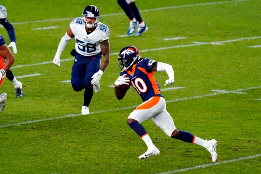 Denver Broncos wide receiver Jerry Jeudy (10) runs the ball as Tennessee Titans linebacker Harold Landry (58) pursues during the first half of an NFL football game, Monday, Sept. 14, 2020, in Denver. (AP Photo/Jack Dempsey)