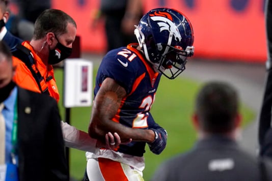 Denver Broncos cornerback A.J. Bouye (21) leaves the game with an injury during the first half of an NFL football game against the Tennessee Titans, Monday, Sept. 14, 2020, in Denver. (AP Photo/Jack Dempsey)