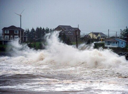 Waves batter the shore in Cow Bay, Nova Scotia, on Wednesday, Sept. 23, 2020. Hurricane Teddy has impacted the Atlantic region as a post-tropical storm, bringing rain, wind and high waves. (Andrew Vaughan/The Canadian Press via AP)