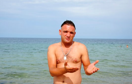 Tarek Aloui talks to The Associated Press on the beach of Ras Jebel, near Bizerte, Tunisia, Wednesday Sept. 23, 2020. Aloui has tried 10 times to reach Italy since 2014. He has succeeded only once, last March at the height of the coronavirus lockdown, and was expelled almost immediately back home, where he was jailed for six months. The number of Tunisians migrating clandestinely to Italy has risen to levels not seen since the 2011 Arab Spring uprising. In Tunisia, the departures now include families and even people who have jobs but can no longer count on their income being enough. (AP Photo/Hassene Dridi)