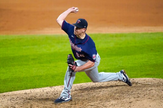Minnesota Twins relief pitcher Trevor May delivers during the ninth inning of the team's baseball game against the Chicago White Sox on Wednesday, Sept. 16, 2020, in Chicago. The Twins won 5-1. (AP Photo/Charles Rex Arbogast)