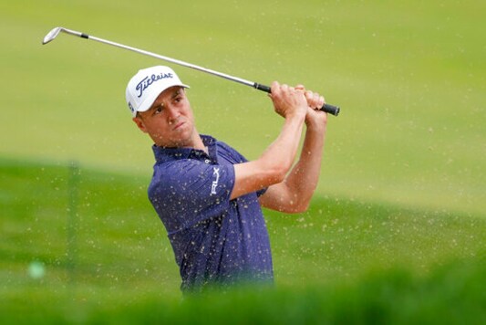 Justin Thomas, of the United States, plays a shot from a bunker on the 17th hole during the first round of the US Open Golf Championship, Thursday, Sept. 17, 2020, in Mamaroneck, N.Y. (AP Photo/Charles Krupa)