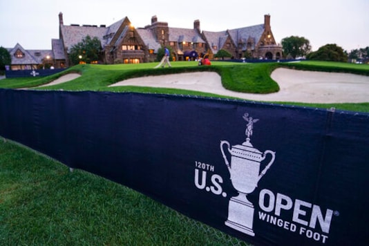 A green is prepared by the grounds crew outside the clubhouse ahead of practices before the U.S. Open Championship golf tournament, Monday, Sept. 14, 2020, at the Winged Foot Golf Club in Mamaroneck, N.Y. (AP Photo/John Minchillo)