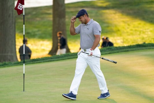 Bryson DeChambeau, of the United States, walks up to the 18th green during the final round of the US Open Golf Championship, Sunday, Sept. 20, 2020, in Mamaroneck, N.Y. (AP Photo/John Minchillo) Bryson DeChambeau, of the United States, walks up to the 18th green during the final round of the US Open Golf Championship, Sunday, Sept. 20, 2020, in Mamaroneck, N.Y. (AP Photo/John Minchillo)