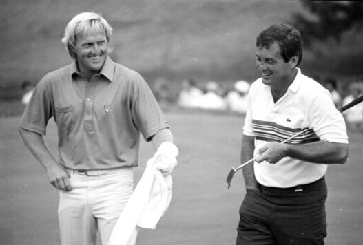 FILE - In this June 18, 1984 file photo, Greg Norman holds a towel out toward Fuzzy Zoeller as they walk down the 18th fairway together at Winged Foot Golf Club in Mamaroneck, N.Y. during a playoff for the U.S. Open Championship. (AP Photo, File)