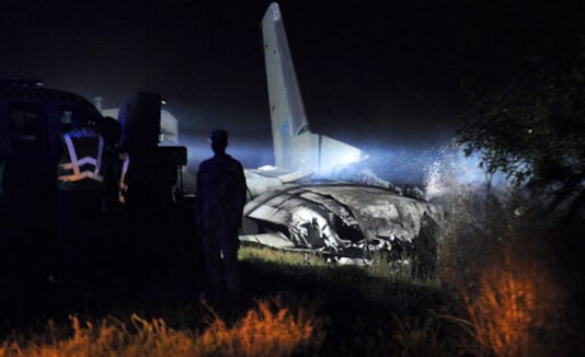 Wreckage of the AN-26 military plane is seen after it crashed in the town of Chuguyiv close to Kharkiv, Ukraine, late Friday, Sept. 25, 2020. A Ukrainian military plane carrying students at an aviation school crashed and burst into flames while landing, killing more than twenty people. Two other people on board were seriously injured and four people were missing. (AP Photo)