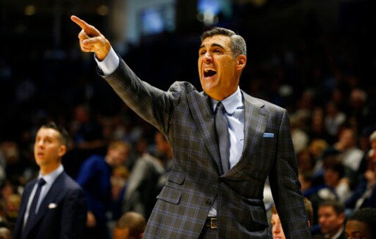 FILE - In this Feb. 22, 2020, file photo, Villanova head coach Jay Wright directs his team during the second half of an NCAA college basketball game against Xavier in Cincinnati. The Division I Council voted Wednesday, Sept. 16, 2020, to start the NCAA men's and women's basketball season Nov. 25, the day before Thanksgiving. (AP Photo/Gary Landers, File)